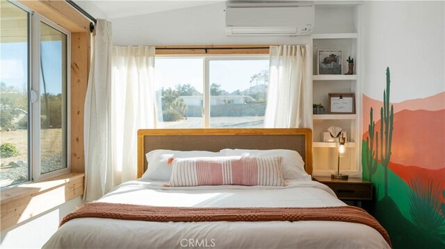 61748 Valley View Cir, Joshua Tree, CA 92252 - bedroom featuring an AC wall unit and vaulted ceiling