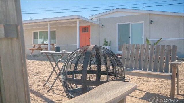 61748 Valley View Cir, Joshua Tree, CA 92252 - back of house featuring stucco siding