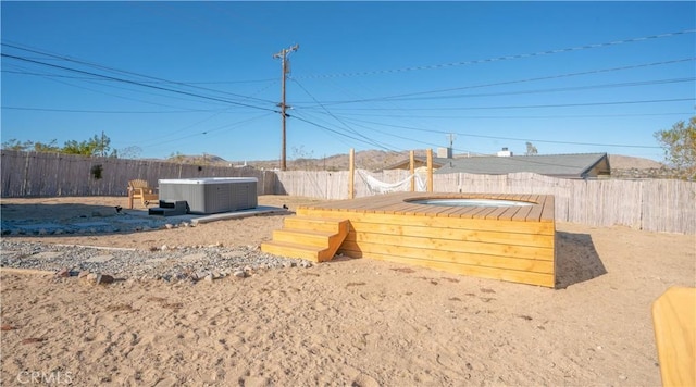 61748 Valley View Cir, Joshua Tree, CA 92252 - fenced backyard with a hot tub and a wooden deck