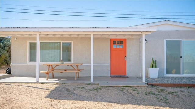 61748 Valley View Cir, Joshua Tree, CA 92252 - entrance to property featuring stucco siding and a patio area