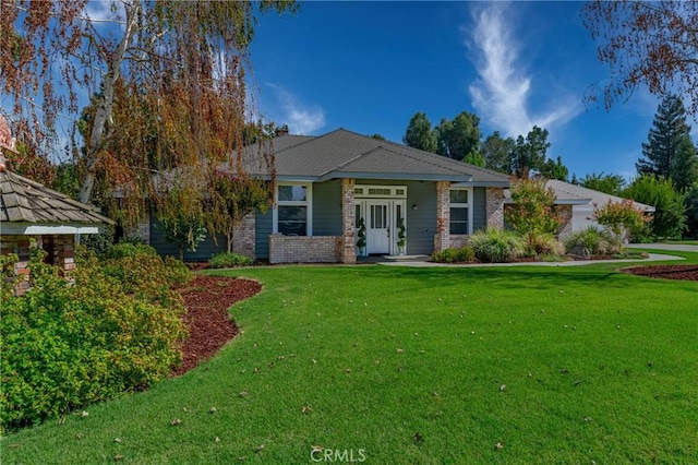 2020 Station Ave, Atwater, CA 95301 - view of front of house featuring a front yard and brick siding
