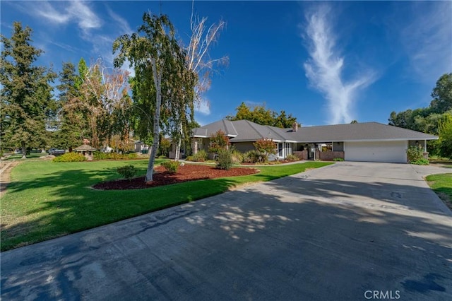 2020 Station Ave, Atwater, CA 95301 - view of front facade featuring driveway, a garage, and a front yard