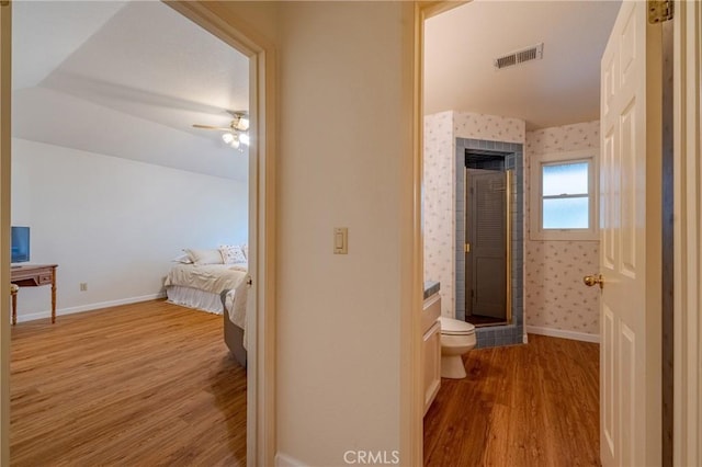 2020 Station Ave, Atwater, CA 95301 - hallway featuring wood finished floors, lofted ceiling, and baseboards
