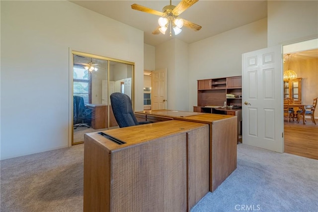 2020 Station Ave, Atwater, CA 95301 - home office featuring light carpet, ceiling fan, and a high ceiling