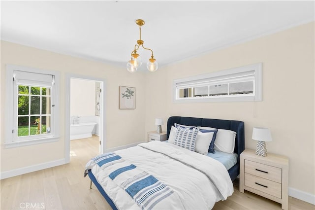 827 Hauser Blvd, Los Angeles, CA 90036 - bedroom with baseboards, light wood-type flooring, and connected bathroom
