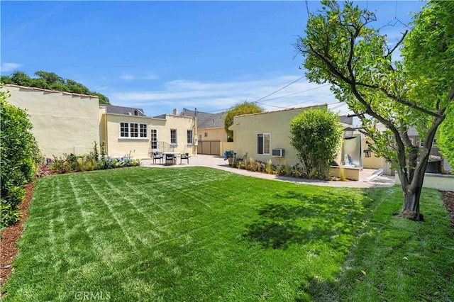 827 Hauser Blvd, Los Angeles, CA 90036 - view of grassy yard featuring a patio