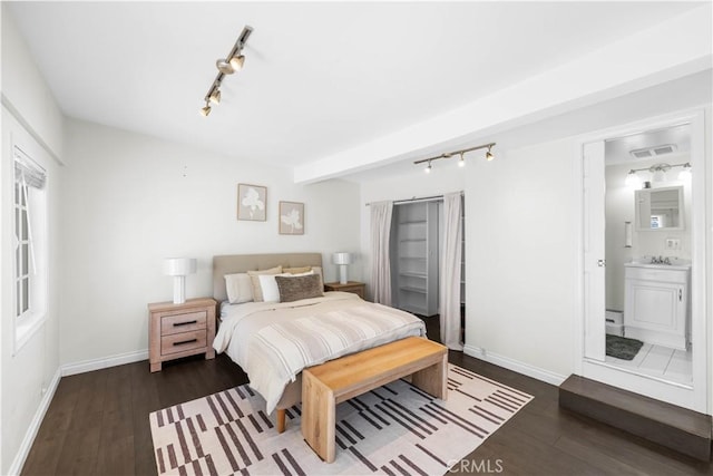 827 Hauser Blvd, Los Angeles, CA 90036 - bedroom featuring rail lighting, baseboards, wood finished floors, and ensuite bathroom