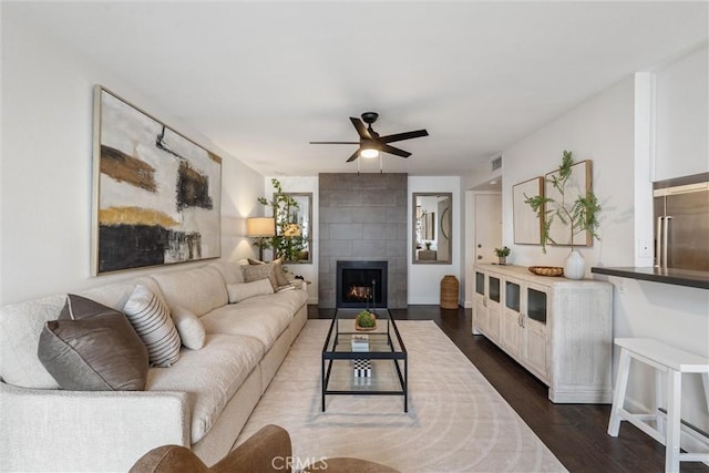 8635 Falmouth Ave Unit 311, Playa Del Rey, CA 90293 - living area featuring a ceiling fan, dark wood-style flooring, and a tiled fireplace