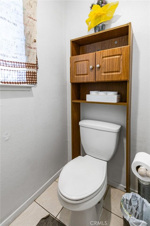 3576 San Jose Ave, Merced, CA 95348 - bathroom featuring tile patterned floors, toilet, and baseboards
