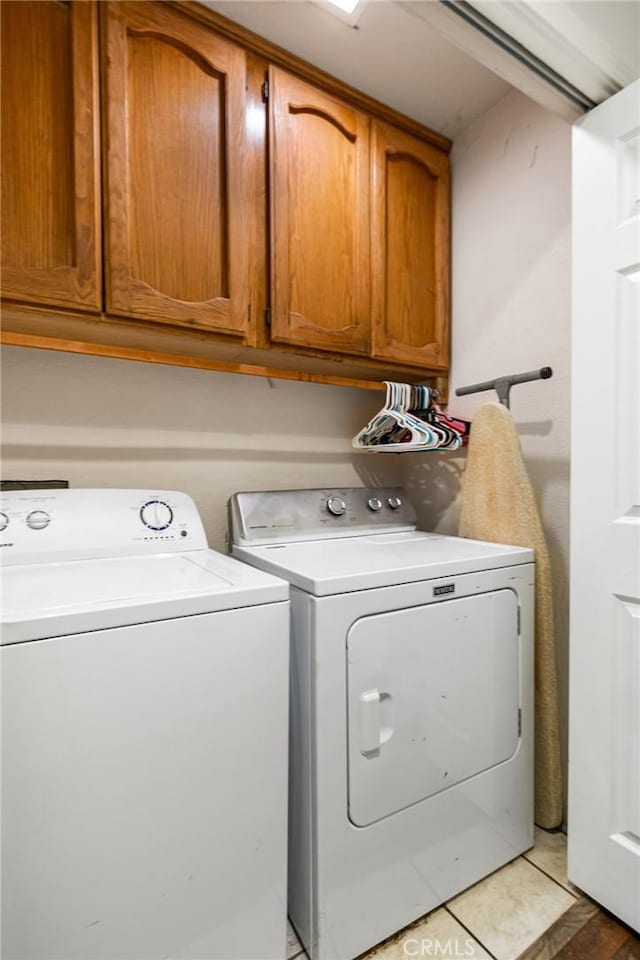 3576 San Jose Ave, Merced, CA 95348 - laundry room with washer and dryer, cabinet space, and tile patterned floors