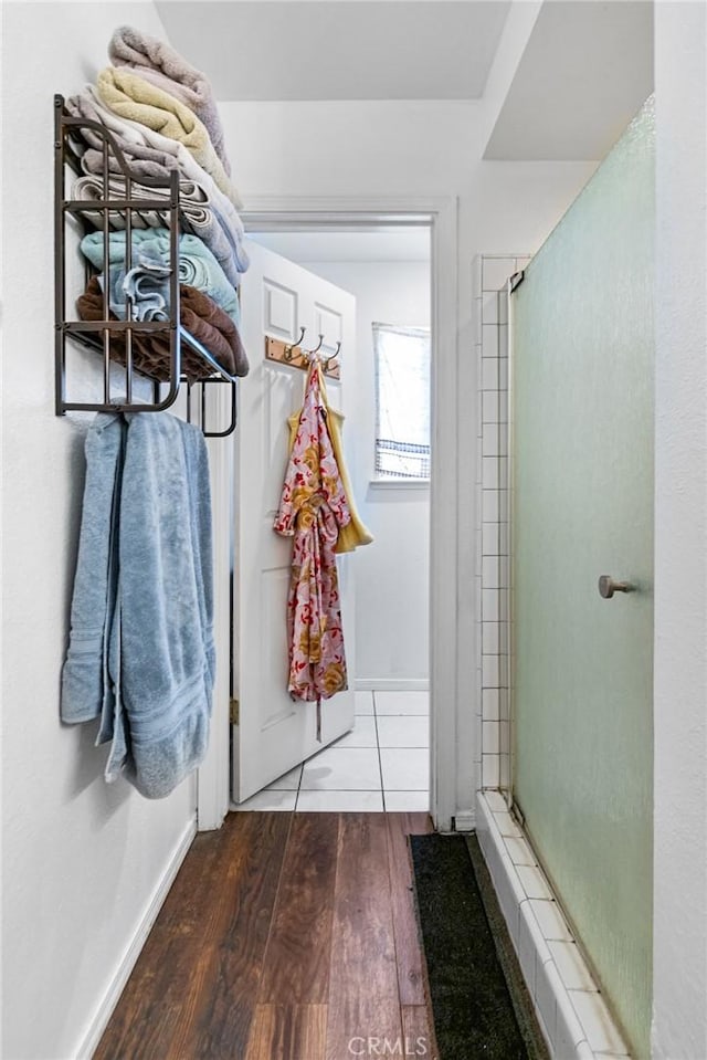 3576 San Jose Ave, Merced, CA 95348 - bathroom featuring wood finished floors, a shower stall, and baseboards