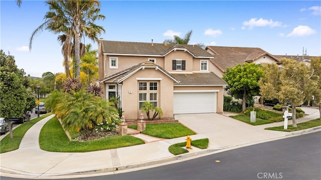 2 Corte Arbertura, San Clemente, CA 92673 - traditional-style house featuring concrete driveway, stucco siding, an attached garage, a tiled roof, and a front yard