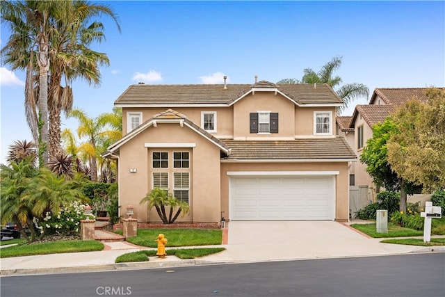 2 Corte Arbertura, San Clemente, CA 92673 - traditional-style house with concrete driveway, a garage, a tile roof, and stucco siding