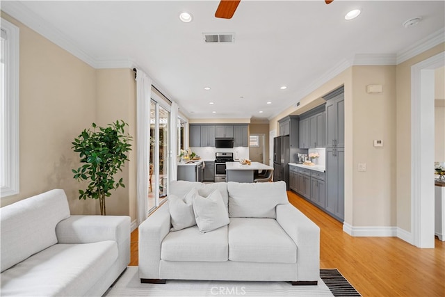 2 Corte Arbertura, San Clemente, CA 92673 - living area with light wood-style floors, a ceiling fan, recessed lighting, baseboards, and ornamental molding