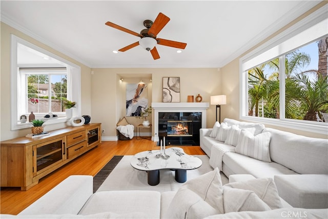 2 Corte Arbertura, San Clemente, CA 92673 - living area with plenty of natural light, light wood finished floors, ceiling fan, recessed lighting, and crown molding