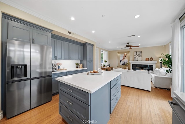 2 Corte Arbertura, San Clemente, CA 92673 - kitchen featuring stainless steel refrigerator with ice dispenser, a center island, recessed lighting, light countertops, and a ceiling fan