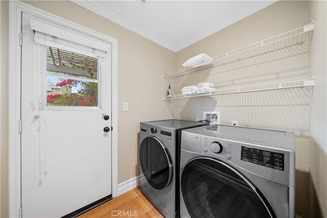 2 Corte Arbertura, San Clemente, CA 92673 - laundry area featuring washing machine and dryer, crown molding, light wood-style floors, and baseboards