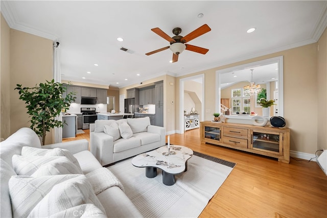 2 Corte Arbertura, San Clemente, CA 92673 - living room with light wood-style floors, a ceiling fan, recessed lighting, crown molding, and a chandelier