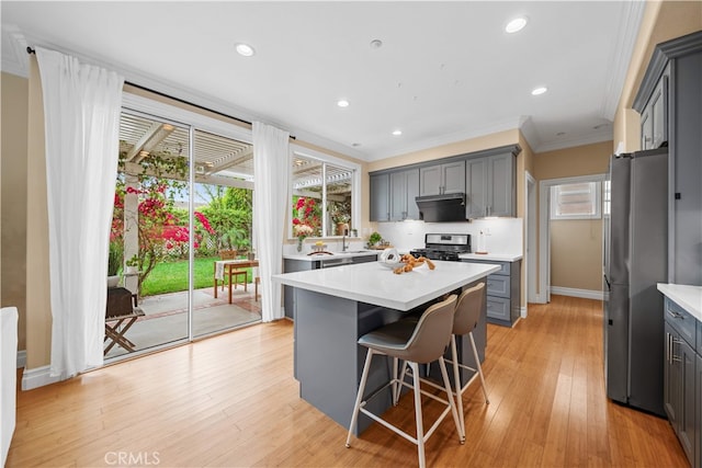 2 Corte Arbertura, San Clemente, CA 92673 - kitchen with stainless steel appliances, gray cabinets, light countertops, ornamental molding, and recessed lighting