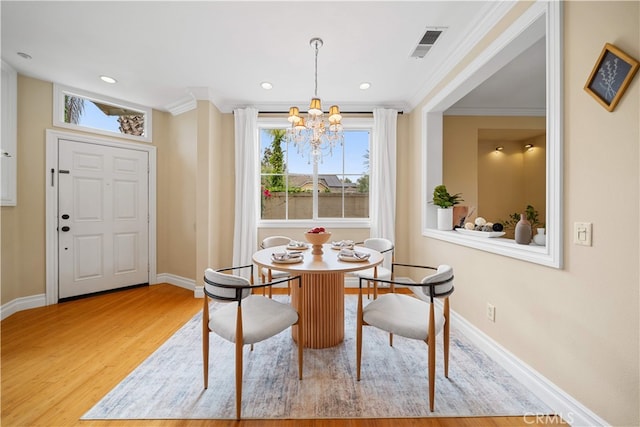 2 Corte Arbertura, San Clemente, CA 92673 - dining space featuring a chandelier, ornamental molding, wood finished floors, baseboards, and recessed lighting