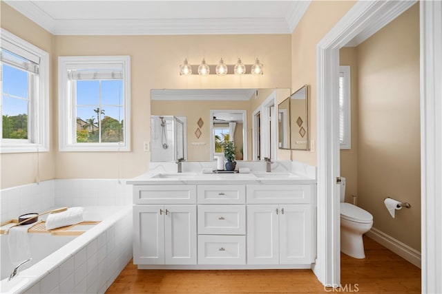 2 Corte Arbertura, San Clemente, CA 92673 - bathroom featuring toilet, double vanity, a garden tub, crown molding, and wood finished floors