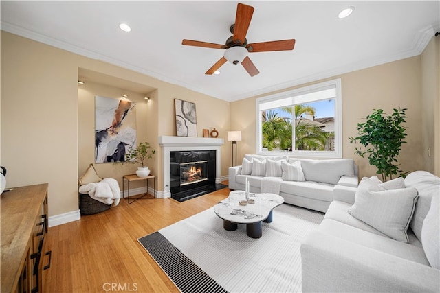2 Corte Arbertura, San Clemente, CA 92673 - living room featuring ceiling fan, a fireplace, crown molding, light wood-type flooring, and recessed lighting