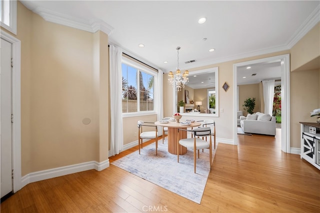 2 Corte Arbertura, San Clemente, CA 92673 - dining space with healthy amount of natural light, light wood-style flooring, a chandelier, ornamental molding, and recessed lighting