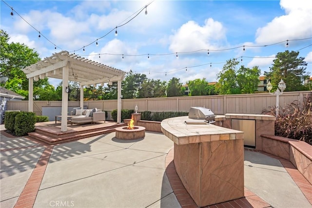 21592 Fernbrook Unit 195, Mission Viejo, CA 92692 - fenced backyard with a fire pit, a patio, and a pergola