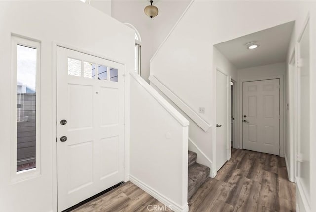 21592 Fernbrook Unit 195, Mission Viejo, CA 92692 - foyer featuring wood finished floors, stairway, and baseboards