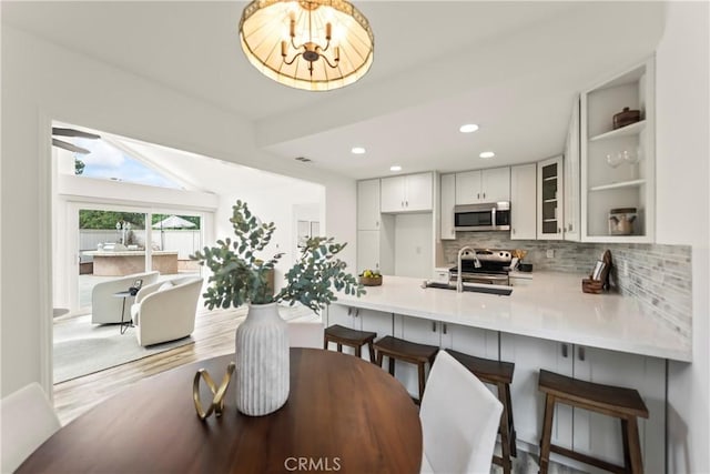 21592 Fernbrook Unit 195, Mission Viejo, CA 92692 - dining room with recessed lighting, wood finished floors, and a chandelier