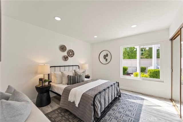 21592 Fernbrook Unit 195, Mission Viejo, CA 92692 - bedroom featuring wood finished floors, recessed lighting, and baseboards