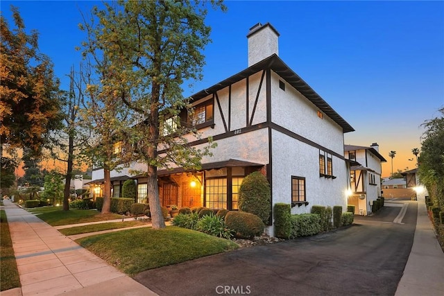 402 El Centro St Unit 13, South Pasadena, CA 91030 - property exterior at dusk with a chimney and stucco siding