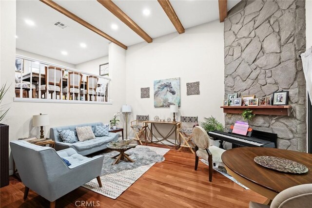 402 El Centro St Unit 13, South Pasadena, CA 91030 - living room with beam ceiling, wood finished floors, and a fireplace