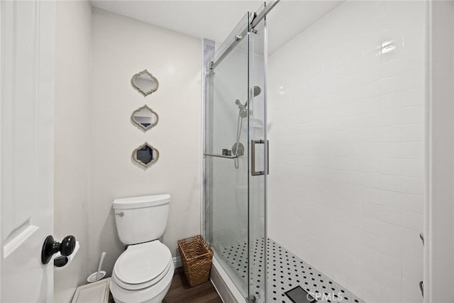 402 El Centro St Unit 13, South Pasadena, CA 91030 - bathroom featuring a shower stall, toilet, wood finished floors, and baseboards