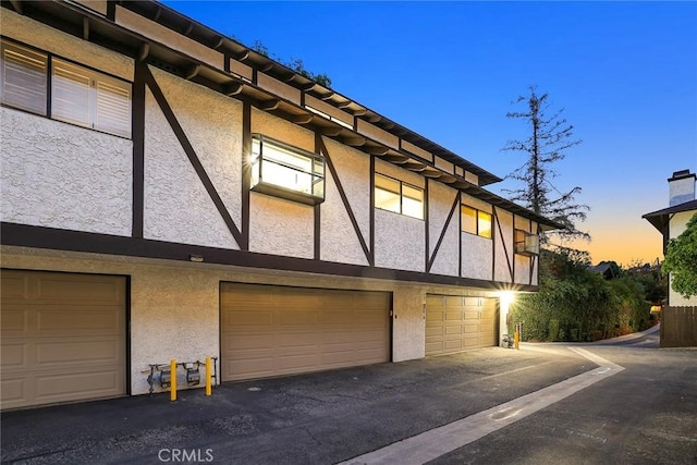 402 El Centro St Unit 13, South Pasadena, CA 91030 - property exterior at dusk with stucco siding and an attached garage