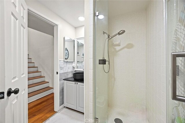 402 El Centro St Unit 13, South Pasadena, CA 91030 - bathroom featuring a stall shower, vanity, and wood finished floors