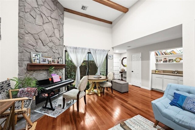 402 El Centro St Unit 13, South Pasadena, CA 91030 - living room with a high ceiling, wood finished floors, beam ceiling, and a stone fireplace