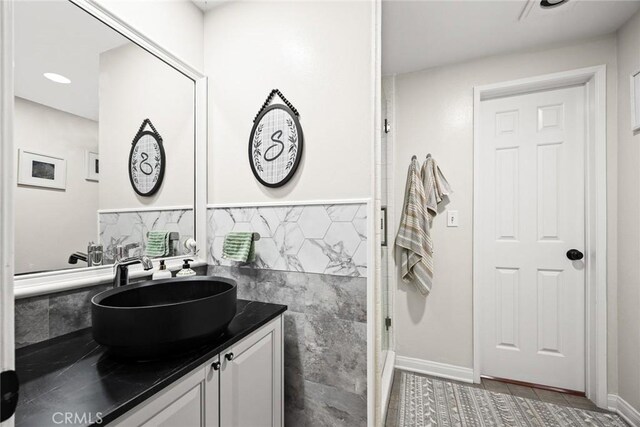 402 El Centro St Unit 13, South Pasadena, CA 91030 - bathroom featuring vanity, baseboards, and tile walls