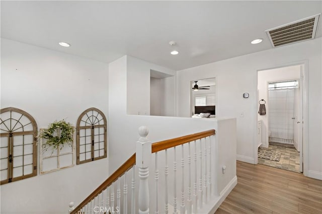 28867 Glencoe Ln, Menifee, CA 92584 - hallway with an upstairs landing, light wood-type flooring, recessed lighting, and baseboards