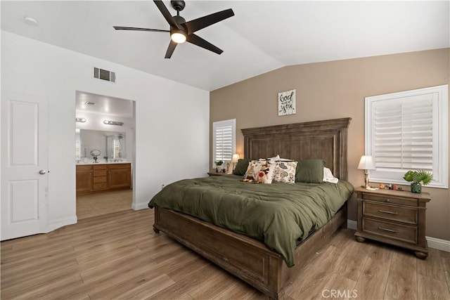 28867 Glencoe Ln, Menifee, CA 92584 - bedroom featuring lofted ceiling, light wood-style flooring, baseboards, ensuite bath, and a ceiling fan