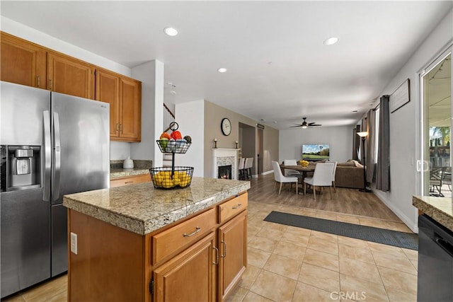 28867 Glencoe Ln, Menifee, CA 92584 - kitchen featuring stainless steel refrigerator with ice dispenser, tile counters, a ceiling fan, dishwashing machine, and recessed lighting