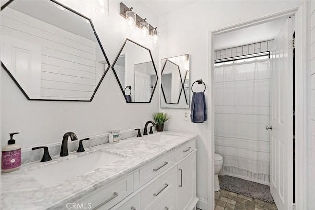 28867 Glencoe Ln, Menifee, CA 92584 - bathroom featuring double vanity and toilet