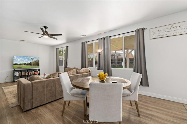 28867 Glencoe Ln, Menifee, CA 92584 - dining space with wood finished floors, ceiling fan, and baseboards