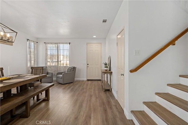 28867 Glencoe Ln, Menifee, CA 92584 - entryway featuring stairs, wood finished floors, recessed lighting, a chandelier, and baseboards