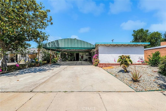 10847 Monogram Ave, Granada Hills, CA 91344 - view of front of property featuring stucco siding and driveway