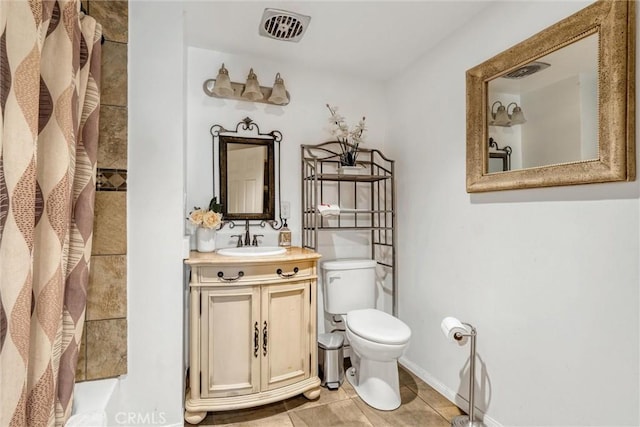 10847 Monogram Ave, Granada Hills, CA 91344 - full bathroom with toilet, tile patterned flooring, vanity, shower / bath combination with curtain, and baseboards