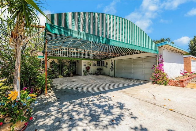 10847 Monogram Ave, Granada Hills, CA 91344 - view of front of home with concrete driveway and stucco siding