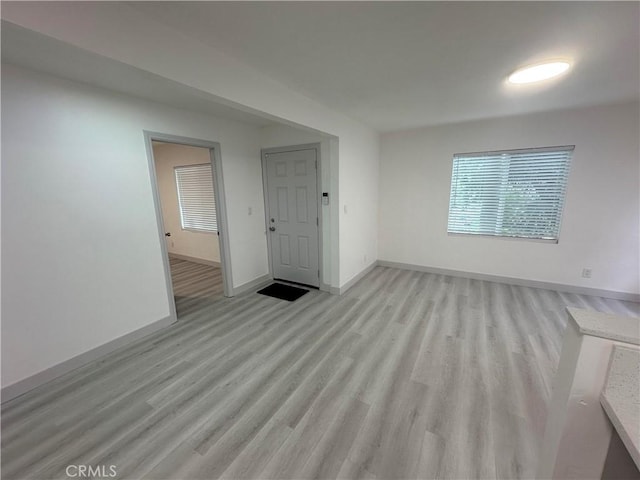 4300 Bancroft Dr, La Mesa, CA 91941 - unfurnished living room with light wood finished floors and baseboards