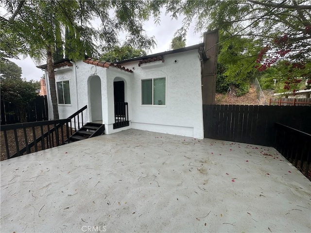 4300 Bancroft Dr, La Mesa, CA 91941 - rear view of house featuring stucco siding and a patio