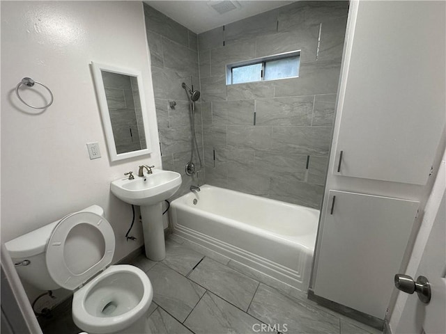 4300 Bancroft Dr, La Mesa, CA 91941 - bathroom with bathing tub / shower combination, toilet, marble finish floors, baseboards, and a sink